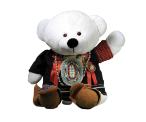 Spirit bear is a stuffed animal dressed in traditional Indigenous clothes and mocassins; waving his left paw.
